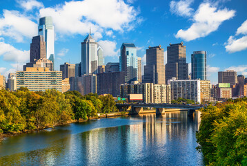 Philadelphia skyline and Schuylkill river. Philadelphia, also known as Philly, is the largest city in Pennsylvania and the second most populous city in the Mid-Atlantic and Northeast regions - 648395340