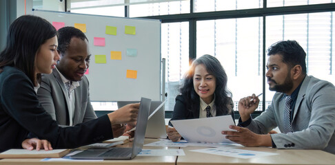 diverse business workgroup designers team with asian woman leader discuss paperwork financial report statistical data, forecasting working on common project. Brainstorm, briefing activity concept