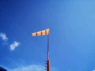 Orange wind direction check air bag Strap with a black line.