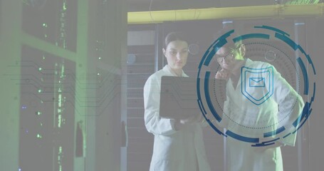 Animation of padlock, shield over diverse engineers discussing on laptop in server room - Powered by Adobe