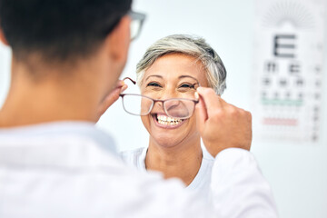 Consulting, optometry and glasses with old woman and doctor for eye care, medical and lens. Healthcare, ophthalmology and vision with senior patient in clinic for exam, eyesight and prescription