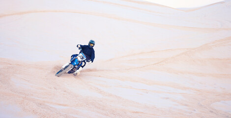 Motorcycle, desert and man training for sports, adventure or travel journey outdoor. Motorbike,...