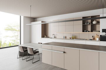 White kitchen interior with island and table, side view