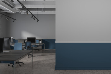 Gray and blue open space office with blank wall