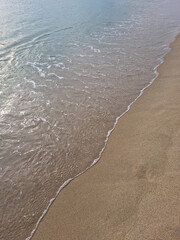 Soft beautiful ocean wave on sandy beach. Background