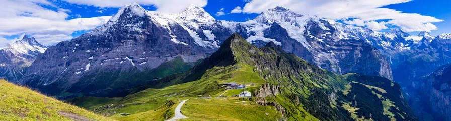 Foto op Canvas Swiss nature scenery. Scenic snowy Alps mountains Beauty in nature. Switzerland landscape. View of Mannlichen mountain and famous hiking route "Royal road" © Freesurf