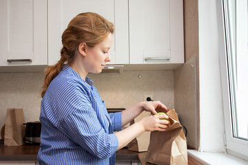 Busy woman preparing a packed lunch for her day ahead,meal control