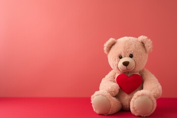 A happy teddy bear sitting and holding a red heart against a pink wall. Generative AI