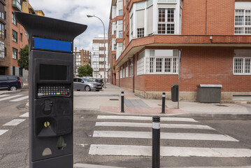 Fototapeta na wymiar A controlled parking meter on a street