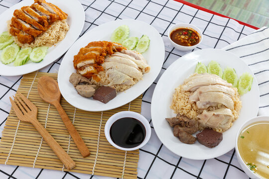 Hainanese chicken rice and chicken fried with soup in the background. thai food concept.