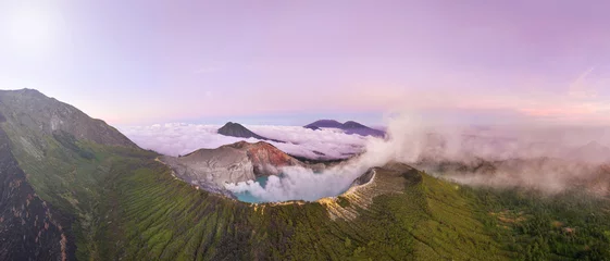 Papier Peint photo Violet Aerial view panorama of rock cliff at Kawah Ijen volcano with turquoise sulfur water lake at sunrise.Amazing nature landscape view at East Java, Indonesia. Natural landscape background