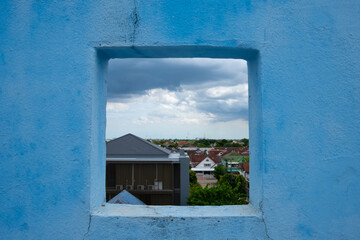 The wall is a gap. When you look at it, you will see a view of the city. with the dark sky