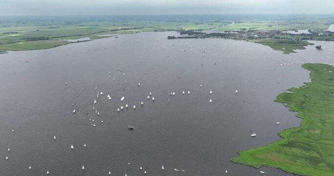 Aerial drone view of sailing boats, leisure activity in Friesland, The Netherlands.