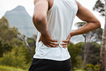 Fitness, nature and a person with back pain after running with a sports injury or accident. Tired,...