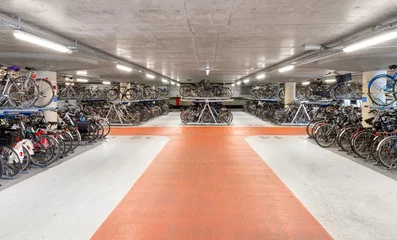 Foto op Canvas Underground bicycle parking. Many bicycles in the two-level parking lot © adragan