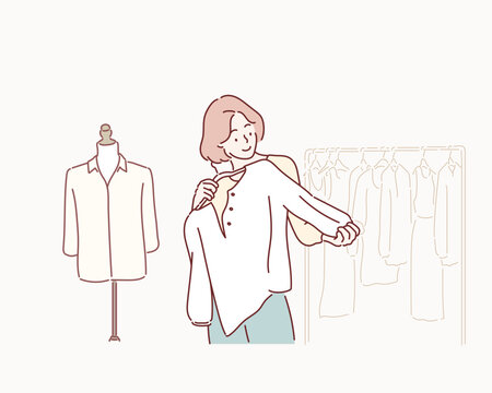 Smiling woman Choose and try on clothe white color in the Tailor shop. Hand drawn style vector design illustrations.