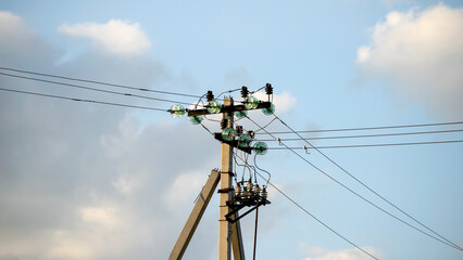 a power line pole in close-up against the sky