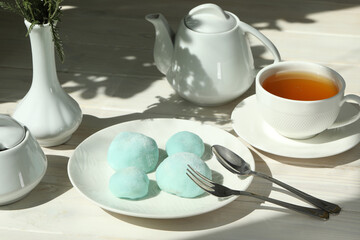 Colorful japanese sweets daifuku or mochi. Sweets close up on the plate with cup of tea