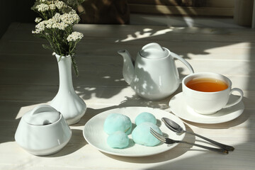 Colorful japanese sweets daifuku or mochi. Sweets close up on the plate with cup of tea