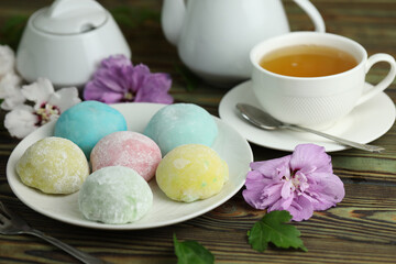 Colorful japanese sweets daifuku or mochi. Sweets close up on the plate with cup of tea