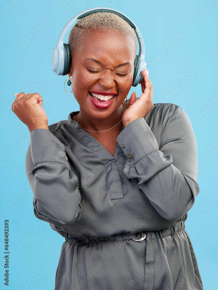 Canvas Prints Happy black woman, headphones and listening to music, audio track or sound against a studio background. Excited African female person smile enjoying podcast, streaming or entertainment on headset