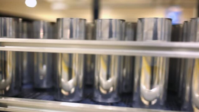 Conveyor line with the production of aluminum cans. Production of aluminum cans for drinks. Plant of high-tech equipment for the food industry.