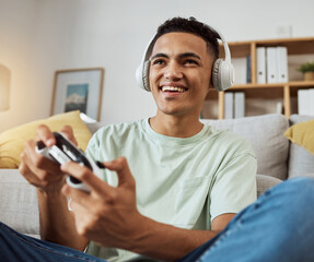Home, game controller and man with headphones, relax and connection on a couch, sound and internet. Happy person, gamer and guy on a sofa, playing online and headset with audio, smile and esports © Mumtaaz D/peopleimages.com