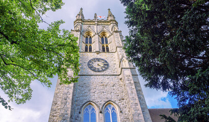 London, England, UK - August 28, 2023: View of the pinnacled tower clock of St. George's Parish...