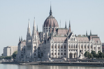 Historical Building of Hungarian Parliament in Budapest, view from Danube River.