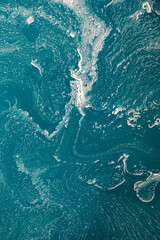 Surface of blue house paint that has separated