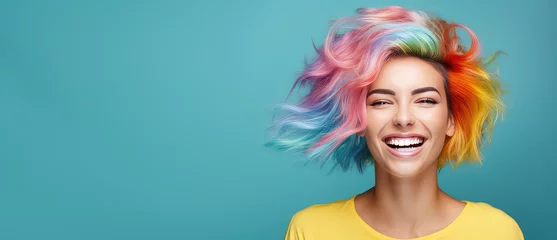 Foto op Aluminium Young beautiful smiling happy woman with rainbow colored wavy hair isolated on flat blue background with copy space, banner template of Creative hair coloring. © SnowElf