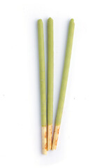 orean sticks with matcha tea a white background