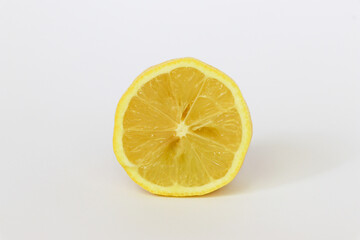 Perfectly retouched sliced half of lemon fruit isolated on the white background with clipping path.