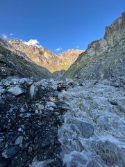 mountain stream against the backdrop of sunset rocks