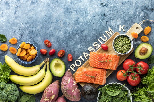 An assortment of foods high in potassium with copy space above.