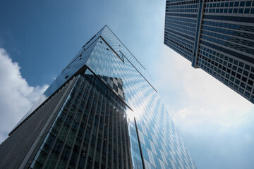 Exterior view of high-rise building against the blue sky - obrazy, fototapety, plakaty