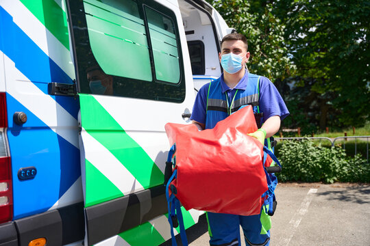 Medic in uniform carries a special vacuum mattress