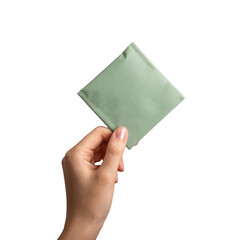 Teabag, sachet, pouch package mockup. Green tea bag mock up in hand, isolated on white