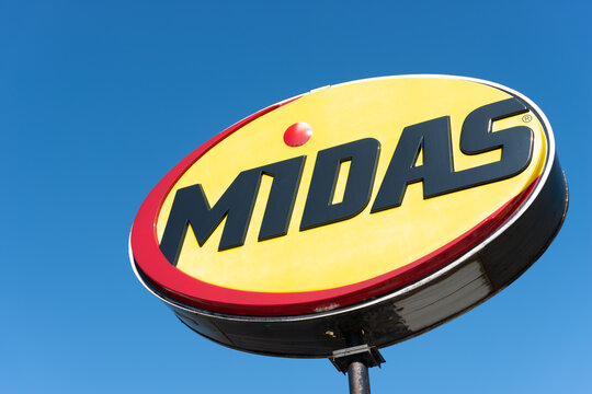 Midas Auto Service (Canada) signage on a blue sky in late summer