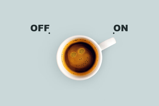 Delicious coffee with a smiley face on a blue background switch on. Energy switch, concept. Good morning, creative idea