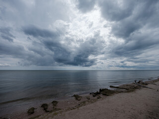 white rain clouds over countryside in summer