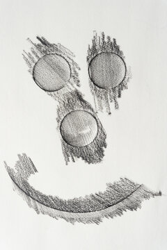 frottage circle shapes with shading lines on blank paper and embossed element
