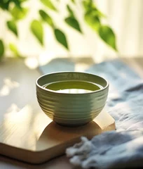 Foto op Canvas Cup of green tea on table © Lina