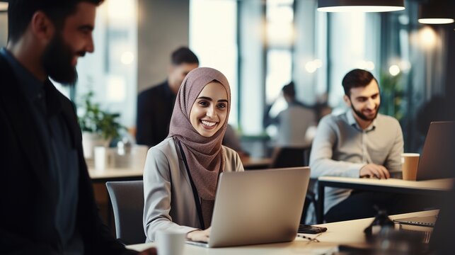 Happy muslim businesswoman in hijab at office workplace. Smiling Arabic woman working on laptop. generative ai