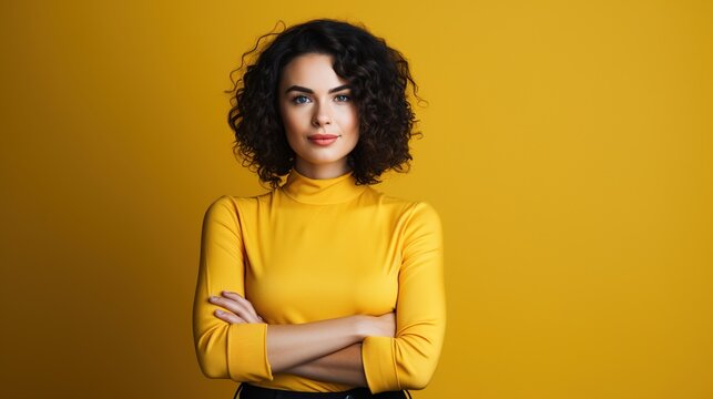 Young woman standing with arms crossed against yellow background. generative ai