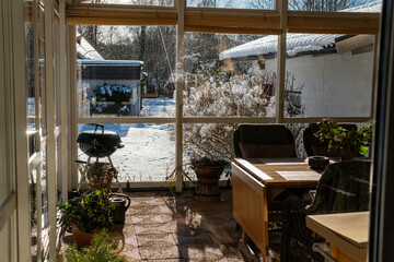 Cozy and vintage living room in a private house filled with warm sunlight during winter. Comfortable relaxing atmosphere, recreational area at home. 