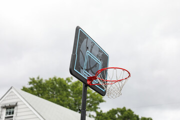 basketball hoop against a clear blue sky, inviting endless play and representing sportsmanship,...