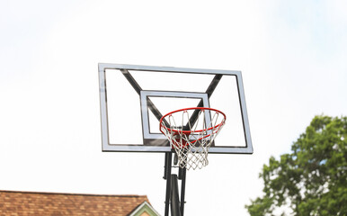 basketball hoop against a clear blue sky, inviting endless play and representing sportsmanship,...