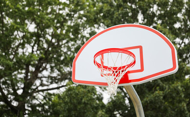 basketball hoop against a clear blue sky, inviting endless play and representing sportsmanship,...