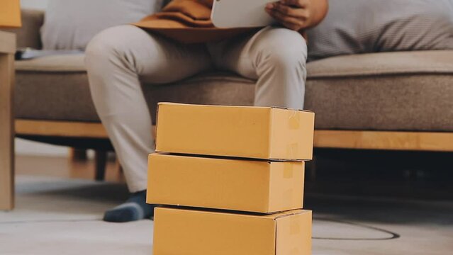 .Young female dress designer sitting at workplace with laptop. Small business owner, entrepreneur, seller checking ecommerce clothing store orders. Shopping concept. Fashion studio.